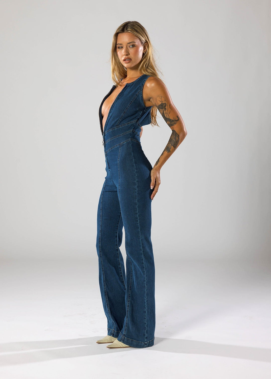 Hendrix | Deep Plunge Zip-Front Denim Jumpsuit with Flared Leg