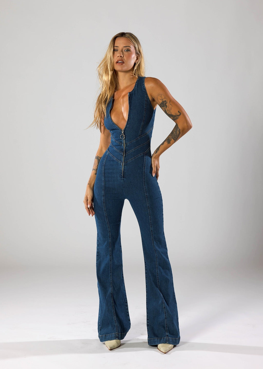 Hendrix | Deep Plunge Zip-Front Denim Jumpsuit with Flared Leg